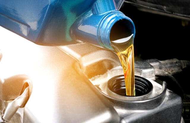 Oil, Lube, Filter Replacement Services Refueling and pouring oil quality into the engine motor car Transmission and Maintenance Gear .Energy fuel concept.